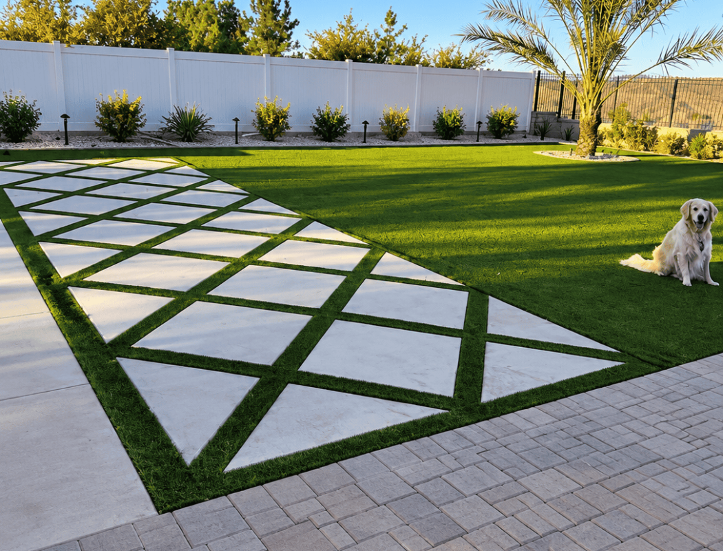 Concrete patio with geometric design, lush lawn, and palm tree in backyard.